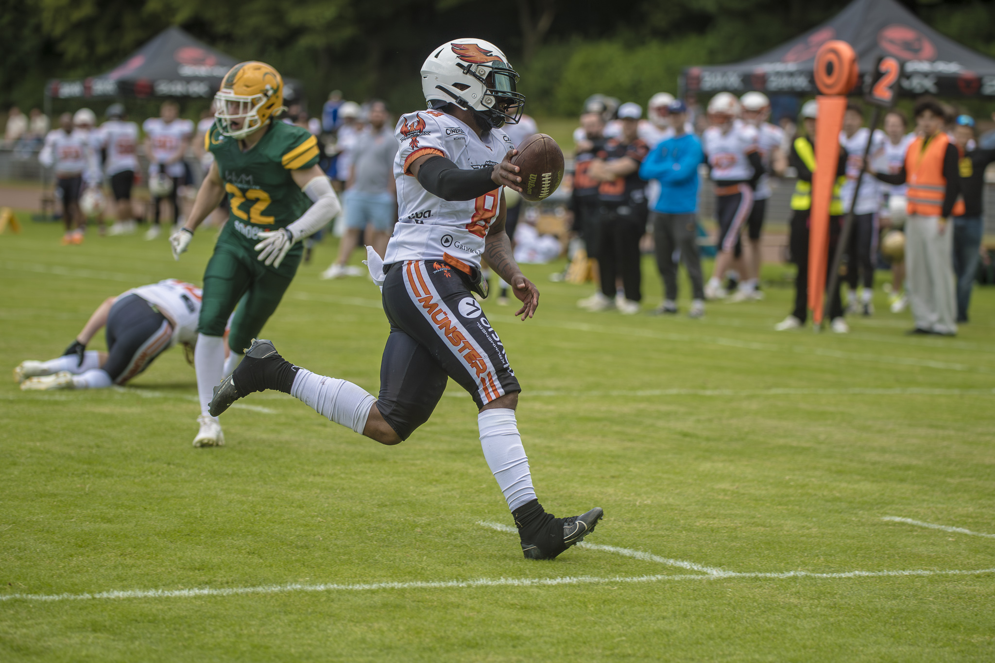 Dämpfer für Münster - Hier im Bild: Malik Brown erzielte einen Touchdown für die Gäste - Foto: Oliver Jungnitsch